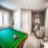 Billiard room at Aspira Empire Crossing Retirement Living